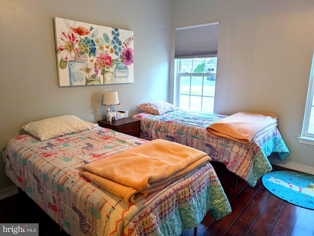 bedroom featuring dark wood-type flooring