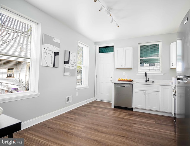 kitchen featuring stainless steel dishwasher, dark hardwood / wood-style floors, white cabinetry, and sink