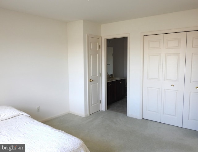 carpeted bedroom featuring a closet