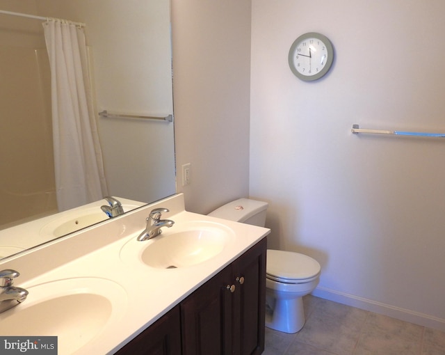 bathroom featuring tile patterned floors, vanity, curtained shower, and toilet