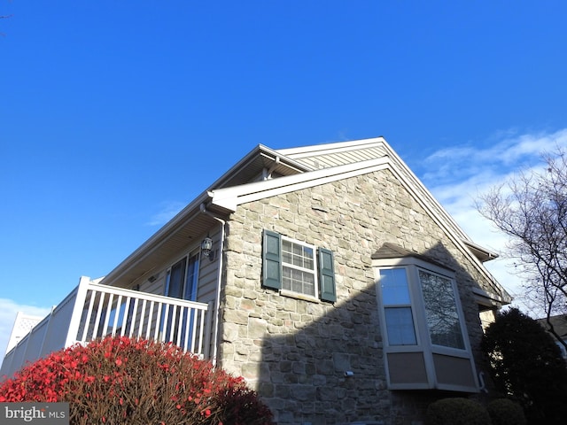 view of property exterior with a balcony