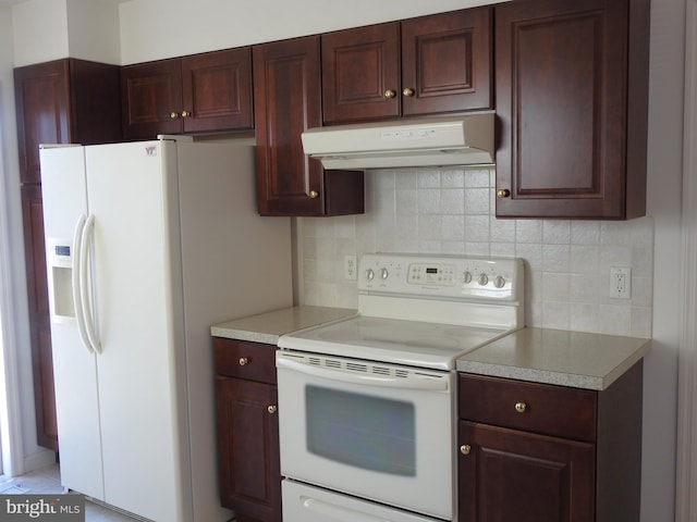 kitchen with white appliances and tasteful backsplash