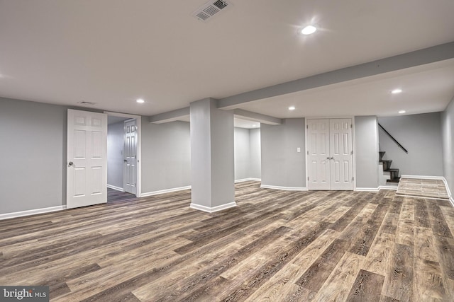 basement featuring dark hardwood / wood-style flooring