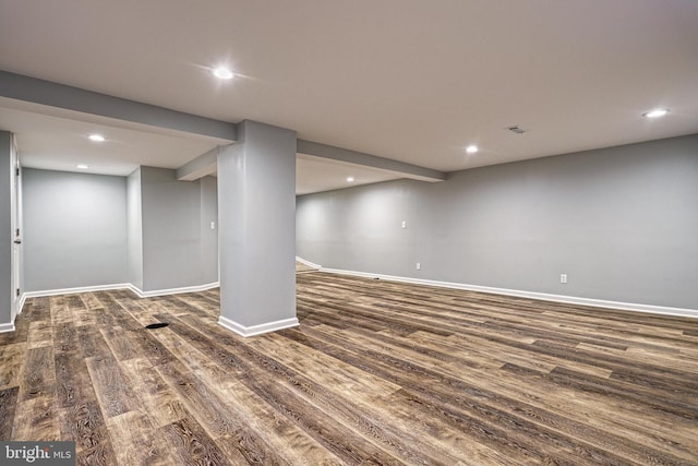 basement with dark wood-type flooring