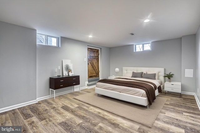 bedroom with hardwood / wood-style floors