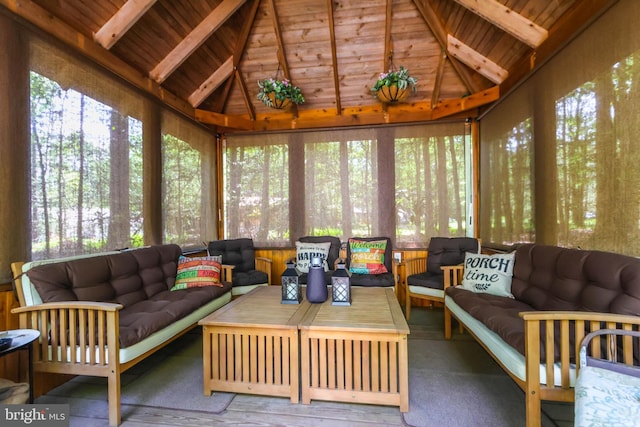 sunroom with lofted ceiling with beams and wood ceiling