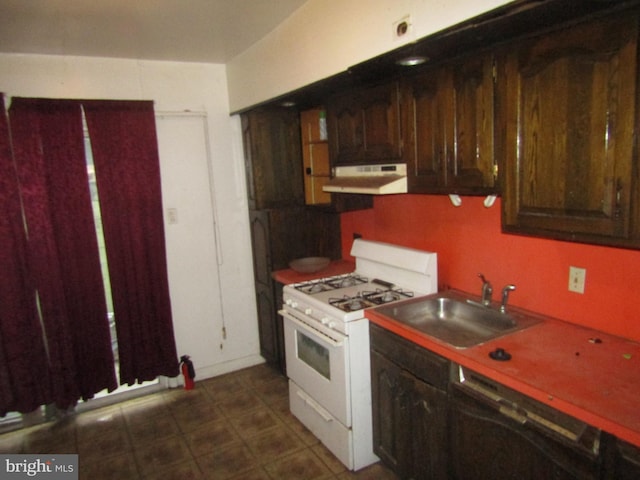 kitchen with white gas range, dishwasher, sink, and dark brown cabinets