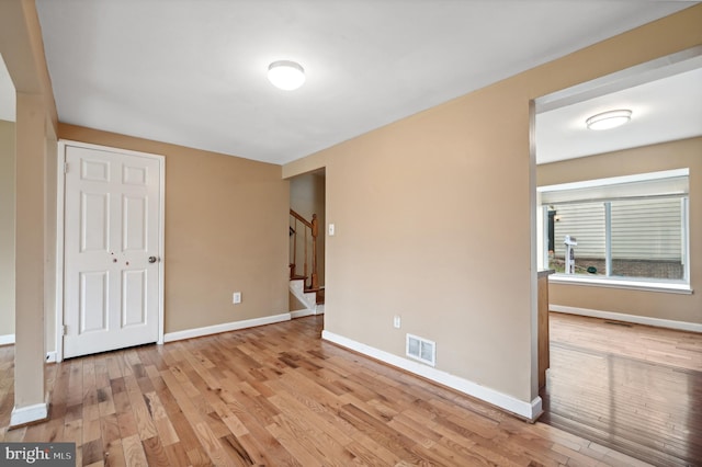 unfurnished room with light hardwood / wood-style floors