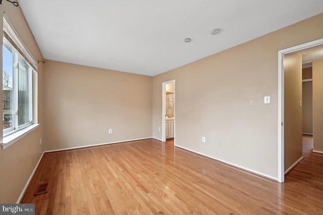 unfurnished room featuring light hardwood / wood-style floors