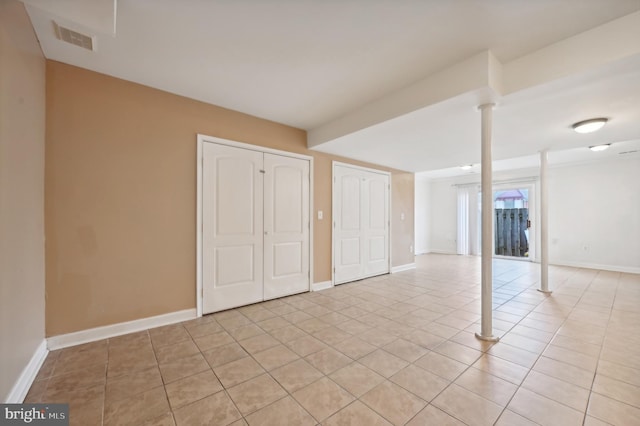 basement featuring light tile patterned floors