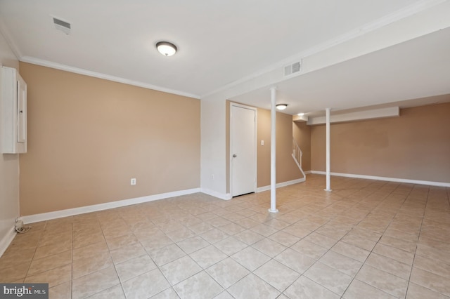 basement with light tile patterned floors and crown molding