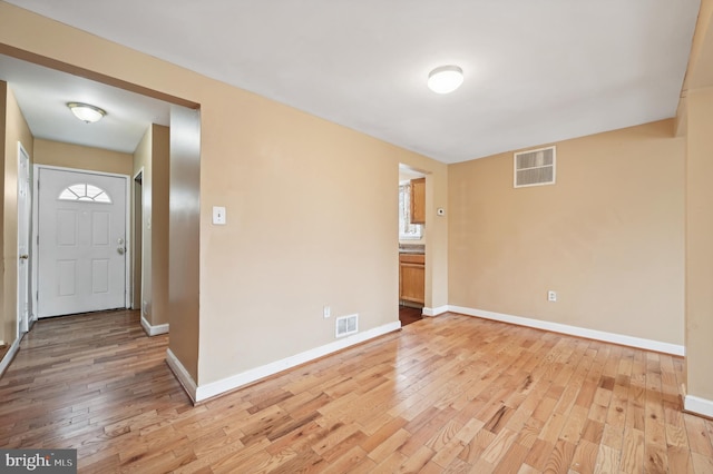 spare room with light wood-type flooring