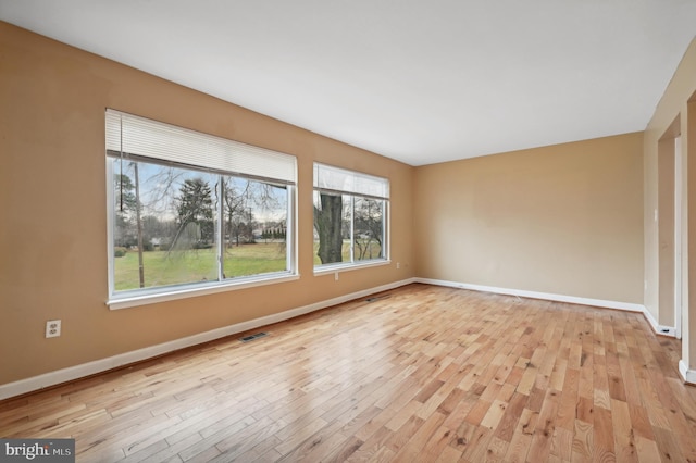 unfurnished room featuring light hardwood / wood-style floors