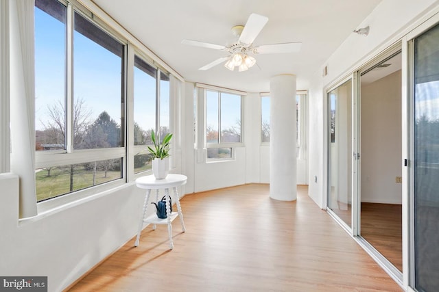 sunroom / solarium with ceiling fan