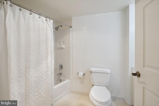 bathroom with toilet, tile patterned floors, and shower / bath combo with shower curtain