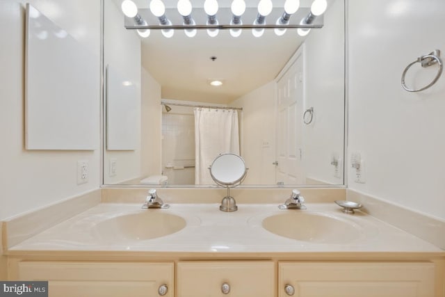 bathroom with vanity and walk in shower