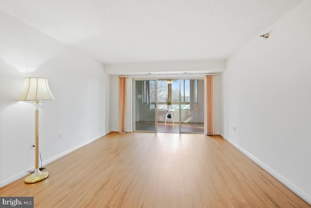 unfurnished room with light hardwood / wood-style floors