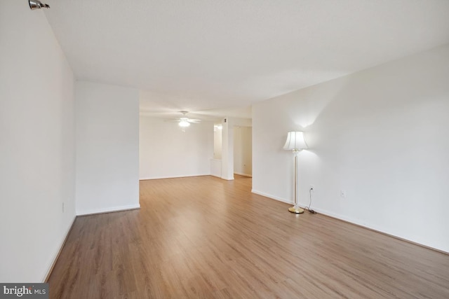 spare room featuring ceiling fan and hardwood / wood-style floors