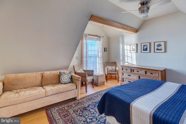 bedroom with hardwood / wood-style flooring, vaulted ceiling, and ceiling fan