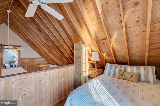 bedroom with wooden walls, ceiling fan, and lofted ceiling