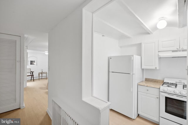 kitchen with white cabinets, light wood-type flooring, white appliances, and a baseboard radiator