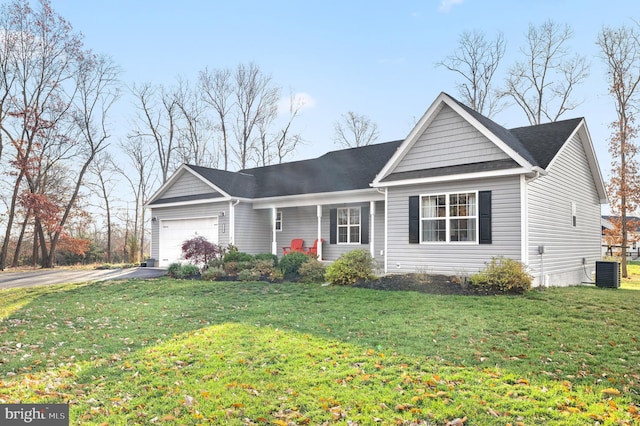 single story home featuring a garage, a front lawn, and central air condition unit