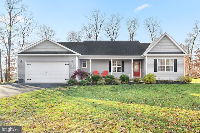 single story home with a front yard and a garage