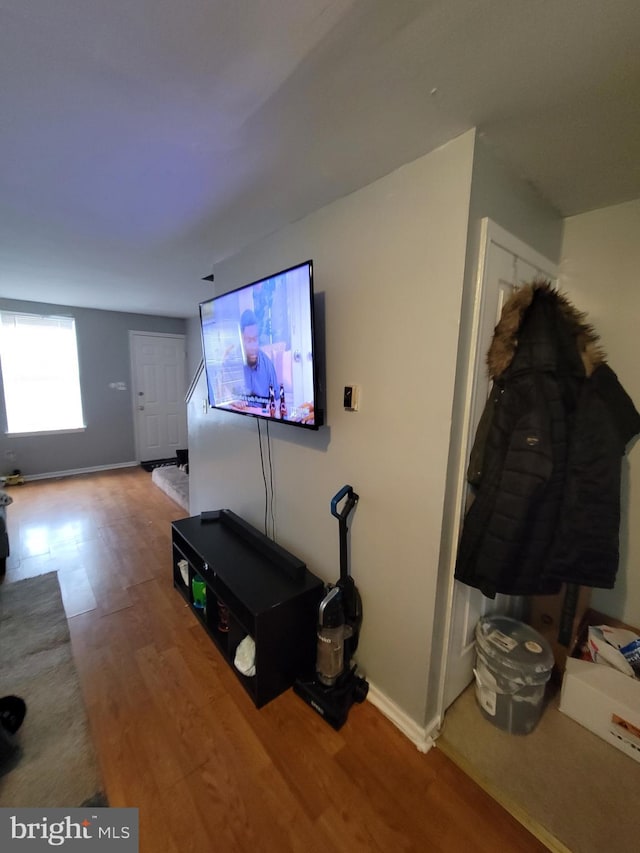 unfurnished living room with wood-type flooring