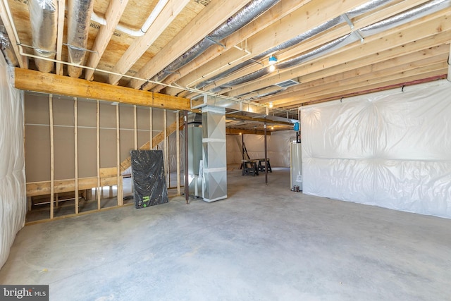 basement featuring water heater and heating unit