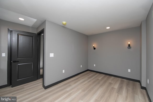 spare room featuring light wood-type flooring