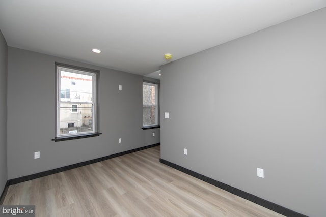 spare room featuring light hardwood / wood-style flooring