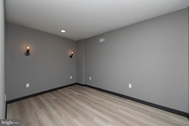 unfurnished room featuring light hardwood / wood-style flooring