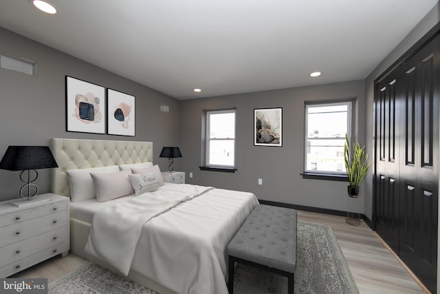 bedroom with light wood-type flooring