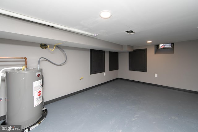 basement with electric panel and water heater