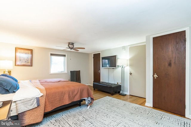 bedroom with light hardwood / wood-style floors and ceiling fan