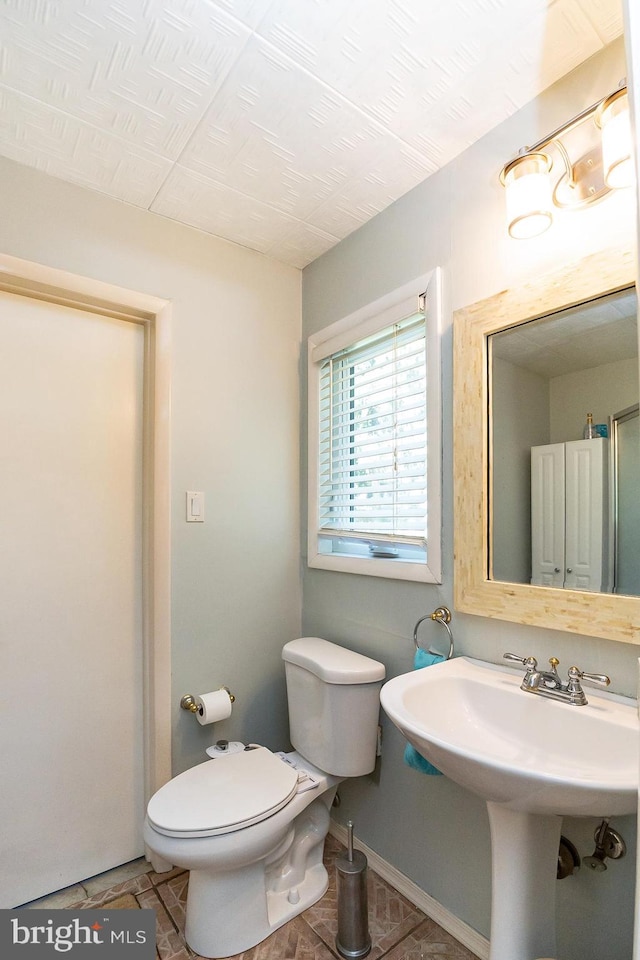 bathroom featuring sink and toilet