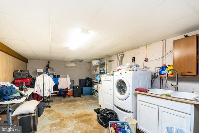 washroom featuring washer and clothes dryer and sink