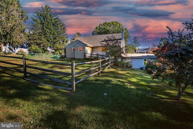 view of yard at dusk