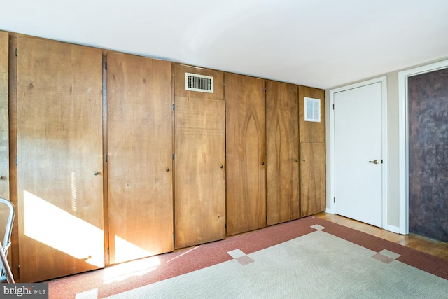 unfurnished bedroom featuring carpet floors and a closet