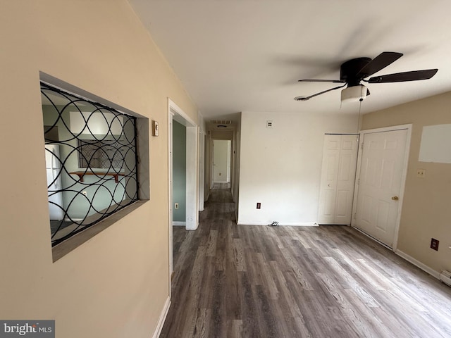 unfurnished bedroom featuring hardwood / wood-style flooring and ceiling fan