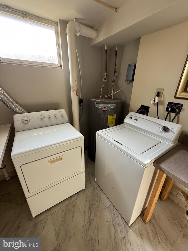 laundry area with electric water heater and independent washer and dryer