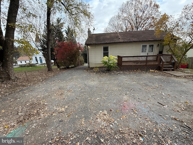 exterior space featuring a wooden deck