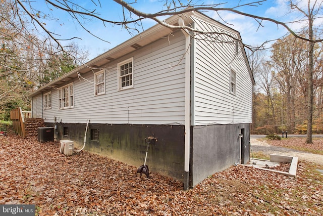 view of side of property with central AC unit