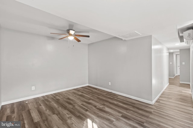 unfurnished room featuring hardwood / wood-style flooring and ceiling fan