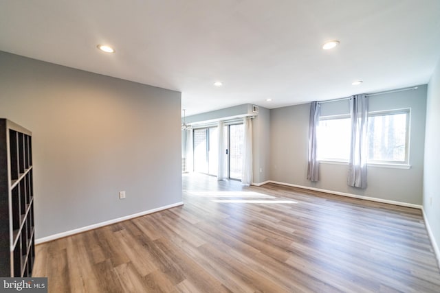 spare room with hardwood / wood-style floors