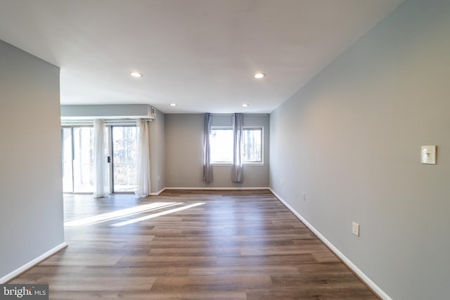 unfurnished room featuring dark hardwood / wood-style flooring