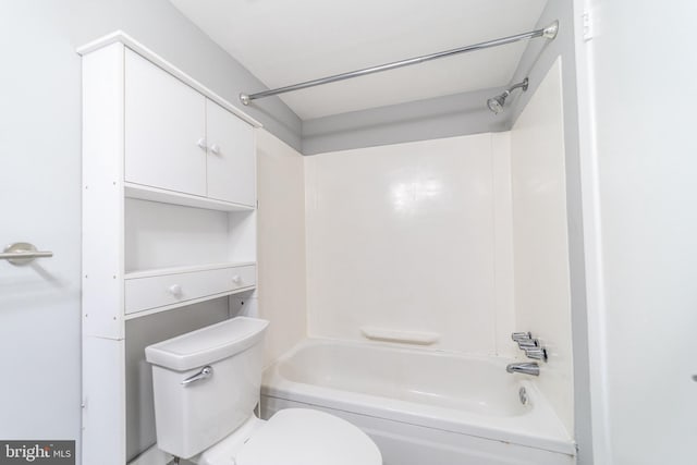 bathroom with shower / bathtub combination and toilet