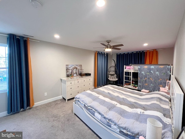 bedroom featuring light carpet and ceiling fan