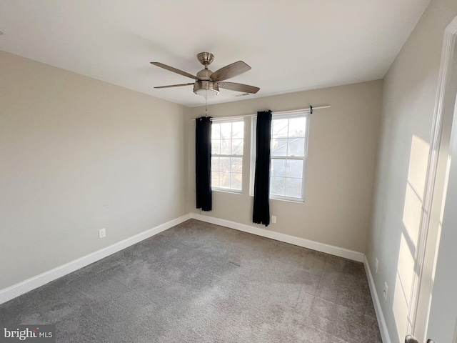 carpeted empty room featuring ceiling fan