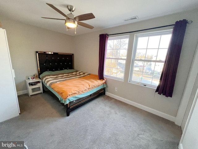 carpeted bedroom with ceiling fan